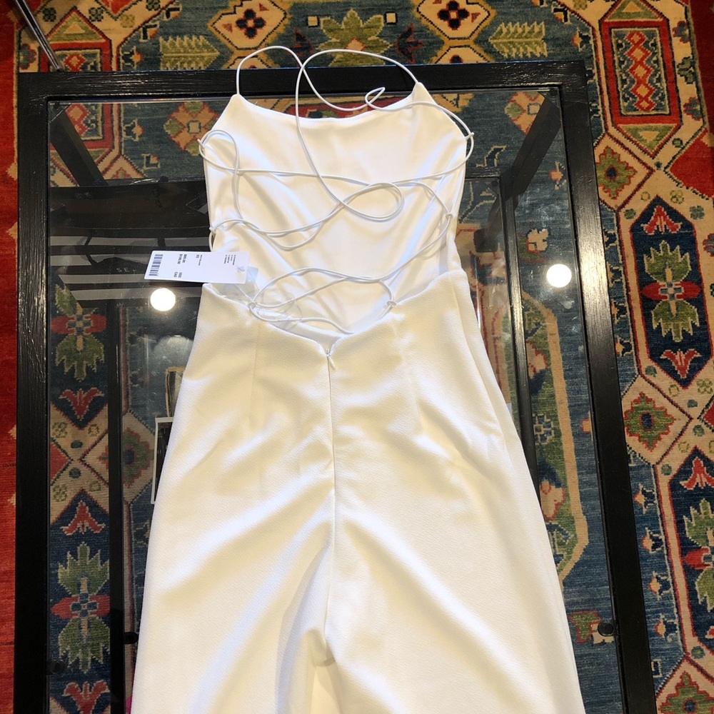 Never worn/tags on Tiger Mist White Jumpsuit XS.